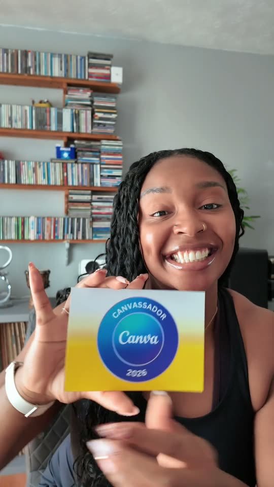 Shana smiling and holding her Canvassador 2026 card to camera